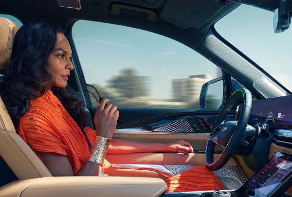 Woman Driving an ESCALADE IQ